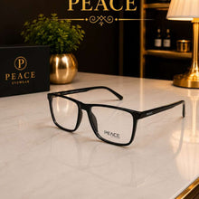 Load image into Gallery viewer, Black rectangular eyeglasses with clear lenses and shiny bold body.
